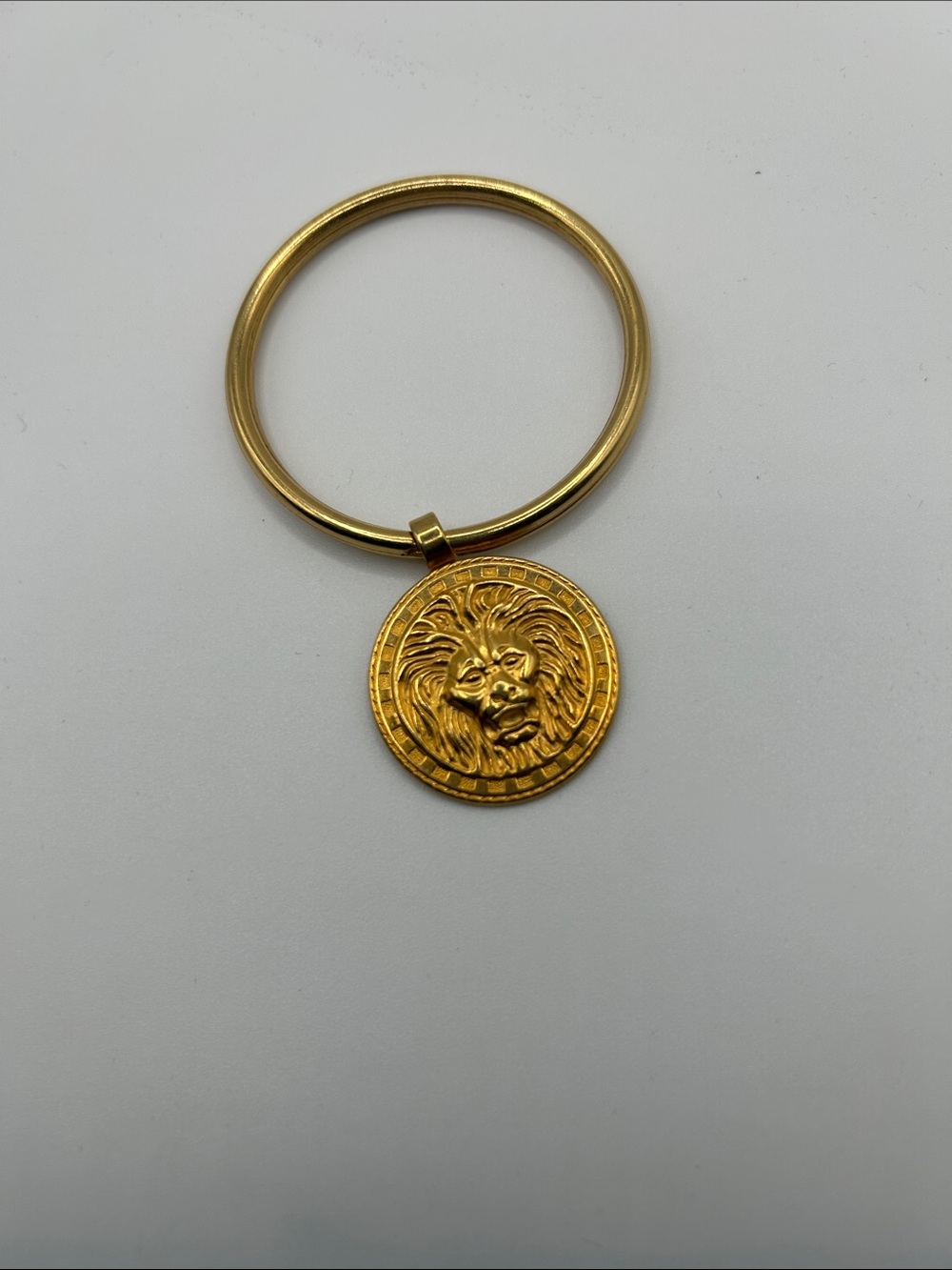 Lion head gold tone key ring statement elegant 
Empowering courage